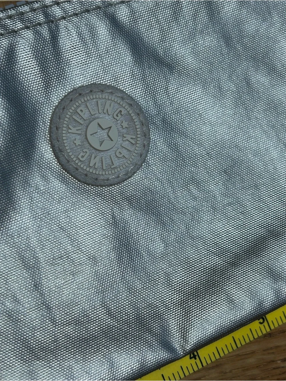 Kipling Metallic Silver Cosmetic Pouch with Monkey Charm